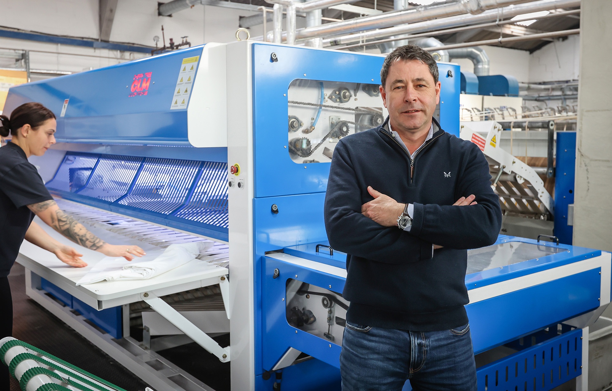 Matthew Barker with commercial laundry machine